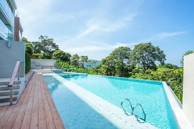 an image of a swimming pool at a house at Ocean Bliss - Sapphire Bay 3BR Apartment 812 with Terrace and Awe-Inspiring Views of Patong Bay in Patong Beach