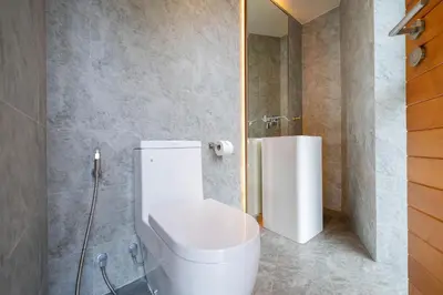 a bathroom with a toilet and a shower at Luxury Ocean View 2BR Apartment 82 in Sapphire Bay Residence, near Patong and Paradise Beach in Patong Beach