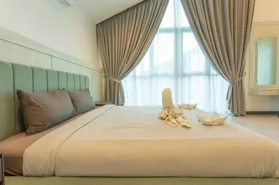 a bed with two stuffed animals sitting on top of it at Nicest In Phuket 4Br 1 km Bang Tao Beach V141 in Bang Tao Beach