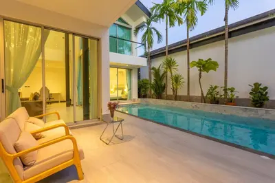 a living room with a swimming pool and a house at Nicest In Phuket 4Br 1 km Bang Tao Beach V141 in Bang Tao Beach
