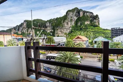 a balcony with a view of a mountain at The BRC Ao-nang Hotel in Ao Nang Beach
