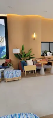 a living room with a couch and a table at Centrally located new and affordable condo for the first mover in Ban Ket Ho