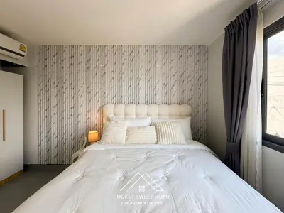 a bedroom with a large white bed in a room at Tower condo Rawai Phuket 305 in Ban Klang