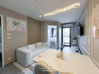a living room with a couch and a table at Tower condo Rawai Phuket 305 in Ban Klang