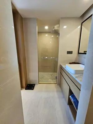 a bathroom with a shower and a sink and a mirror at La Vita Stylish apartment in 5 star hotel in Rawai Beach