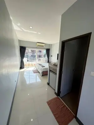 a room with a bedroom and a bed in it at \u30a2\u30de\u30c6\u30e9\u30b9\u30d1\u30c8\u30f37 in Patong Beach