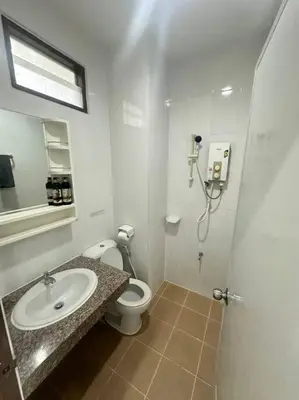 a bathroom with a toilet and a sink and a shower at \u30a2\u30de\u30c6\u30e9\u30b9\u30d1\u30c8\u30f37 in Patong Beach