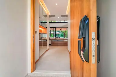 a hallway with a door to a room at Banyan Tree Grand Residences by Banyan Living in Phuket Town
