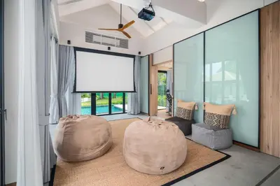 a living room with two bean bags on the floor at Banyan Tree Grand Residences by Banyan Living in Phuket Town