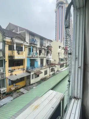 a view from a window of a street with buildings at Nice to CU Guest house in Patong Beach