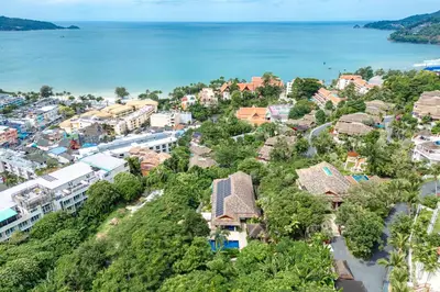 an aerial view of a city and the ocean at \u82ad\u4e1c\u65e5\u6708\u53cc\u6d77\u666f\u522b\u5885 in Patong Beach