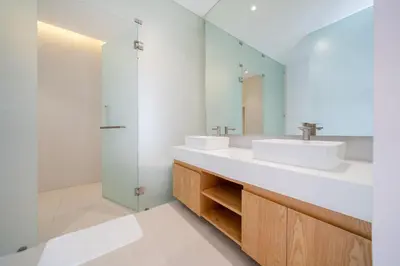 a bathroom with two sinks and a shower at Sofia Villa Phuket in Phuket Town