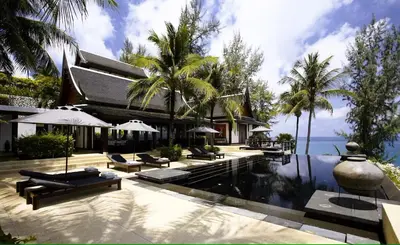 a house with a swimming pool and a resort at 00 - Thai Paradise on Kamala Bay in Amphoe Thalang
