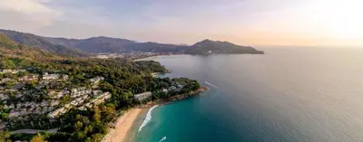 an aerial view of a beach and the ocean at 00 - Thai Paradise on Kamala Bay in Amphoe Thalang