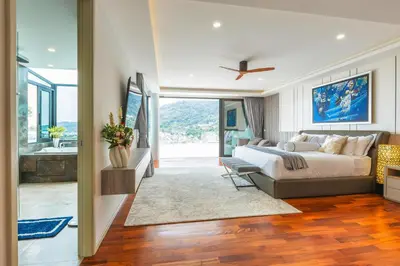 a bedroom with a large bed and a bathroom at 