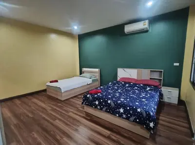 a bedroom with two beds in a room at Bonanza Patong Beach2 for 2 BR 100m to Beach Grand Room in Patong Beach