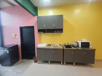 a kitchen with a counter and a sink in a room at Bonanza Patong Beach2 for 2 BR 100m to Beach Grand Room in Patong Beach