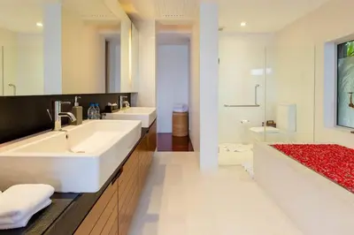 a bathroom with a large white sink and a shower at 28 - Sea View Luxury Pool Villa in Phuket Town