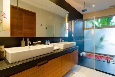 a bathroom with a large sink and a shower at 28 - Sea View Luxury Pool Villa in Phuket Town