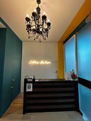 a chandelier hanging over a cash register in a store at Chill-long inn in Ban Klang
