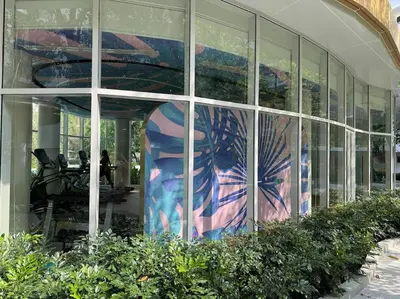a building with a painting on the side of it at Phyll Phuket - Luxury Resort-Style Comfort in Ban Rangeng