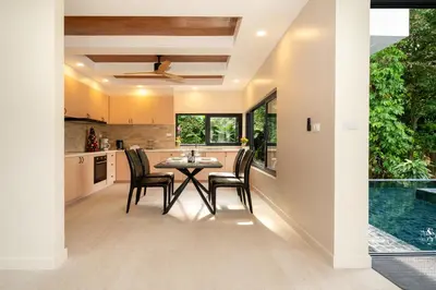 a kitchen and dining room with a table and chairs at patong hill villa 3 in Patong Beach