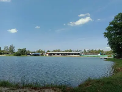 a large lake with a building in the background at Zcape Condotel Bangtao Beach in Bang Tao Beach
