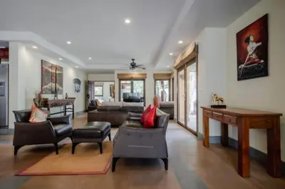 a living room with a couch and a table at NEW Phuket Residence 2 Bedrooms Charming House in Rawai Beach