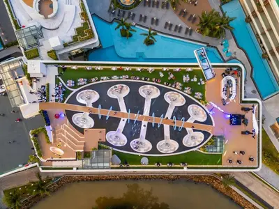 an overhead view of a pool at a resort at Kora Beach Resort Phuket in Bang Tao Beach