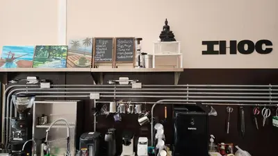 a coffee shop with a counter top with a coffee maker at IHOC - Phuket OldTown in Ban Lo Long