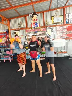 a group of people standing in a boxing gym at thechalethome in Panwa Beach