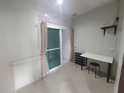 a white room with a desk and a window at Room Phuket Town by Alissa in Ban Phlu Yai