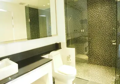 a bathroom with a toilet and a sink and a shower at Nakalay Palm by Thaire in Kamala Beach