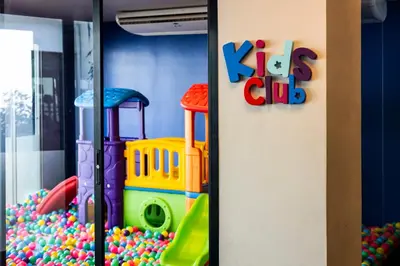 a kids club room with a toy playground at Karon Beach Residence in Karon Beach