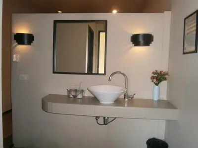 a bathroom with a sink and a mirror at Infinity Boutique Hotel Kata Beach in Kata Beach