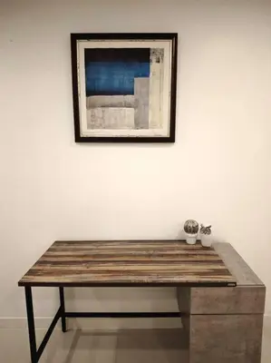 a wooden table in front of a wall with a picture at Karon Beach Large 2 bedrooms & living room Seaview apartment in Karon Beach