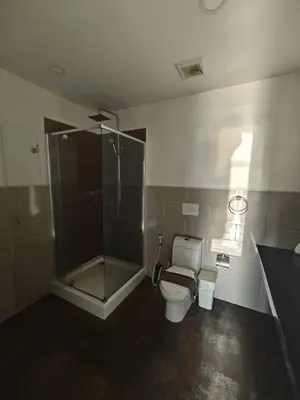 a bathroom with a shower and a toilet and a sink at Karon Beach Large 2 bedrooms & living room Seaview apartment in Karon Beach