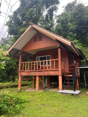 a large wooden house with a large deck at ThaKhaopierBangalow in Ban Bang Chak