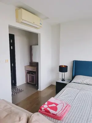 a bedroom with a bed with a blanket with hearts on it at 38Nice room phuket town near Shopping Malls and Naka night market in Phuket Town