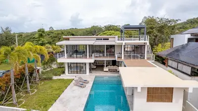 an aerial view of a house with a swimming pool at ANDAMAN Villa KOH YAO NOI in Ko Yao Noi