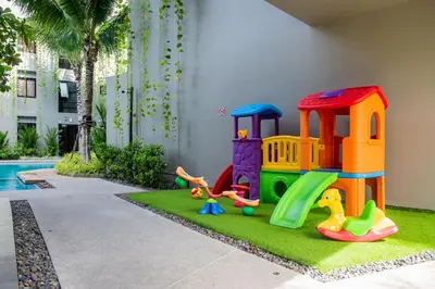 a childrens play area with a toy playground at Apartment 2 BDR Bangtao #2206 in Phuket