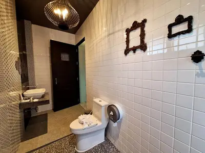 a bathroom with a toilet and a sink at Seava House Ao-Nang Krabi in Ao Nang Beach