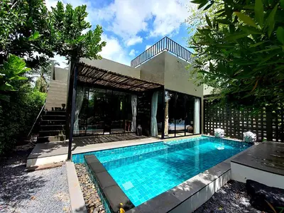 a swimming pool in front of a house at Seava House Ao-Nang Krabi in Ao Nang Beach