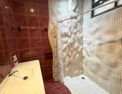 a bathroom with a shower and a sink at Kamala beach house 100m to the beach in Kamala Beach