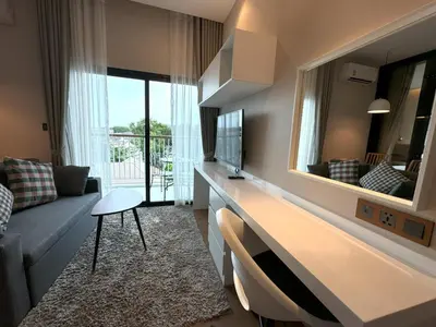 a living room with a couch and a large mirror at Private apartment Title V Condo by Lofty in Rawai Beach