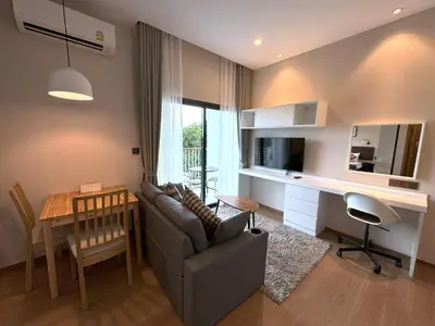 a living room with a couch and a table and a desk at Private apartment Title V Condo by Lofty in Rawai Beach