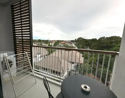 a balcony with a table and a view of a city at Private apartment Title V Condo by Lofty in Rawai Beach