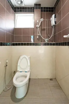 a bathroom with a toilet and a window at Pool Villa 3 Bedrooms, Closeby Patong, Chic and Quiet in Kathu