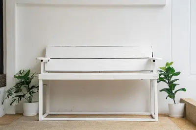 a white bench in a room with two plants at Pool Villa 3 Bedrooms, Closeby Patong, Chic and Quiet in Kathu