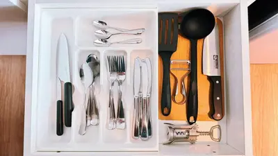 a white drawer filled with silver utensils at Luxury studio near Nai Harn beach in Rawai Beach